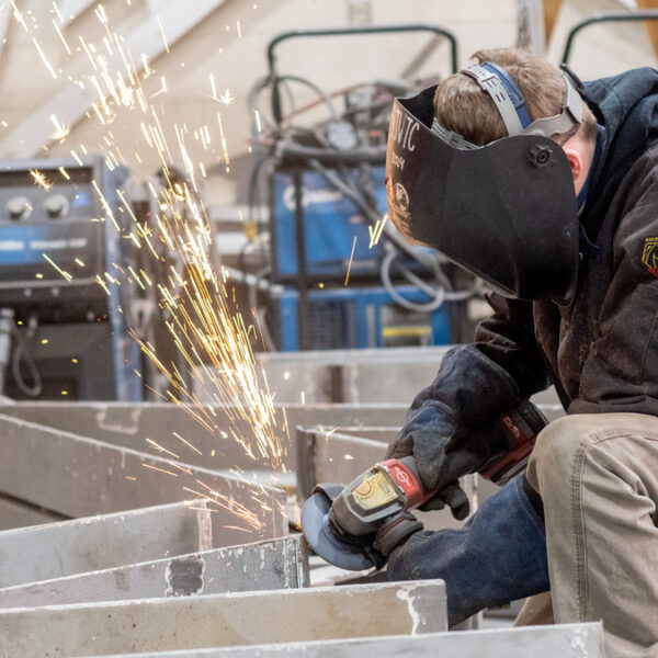 Tech students learn real-world skills while forging massive Acadian sculpture