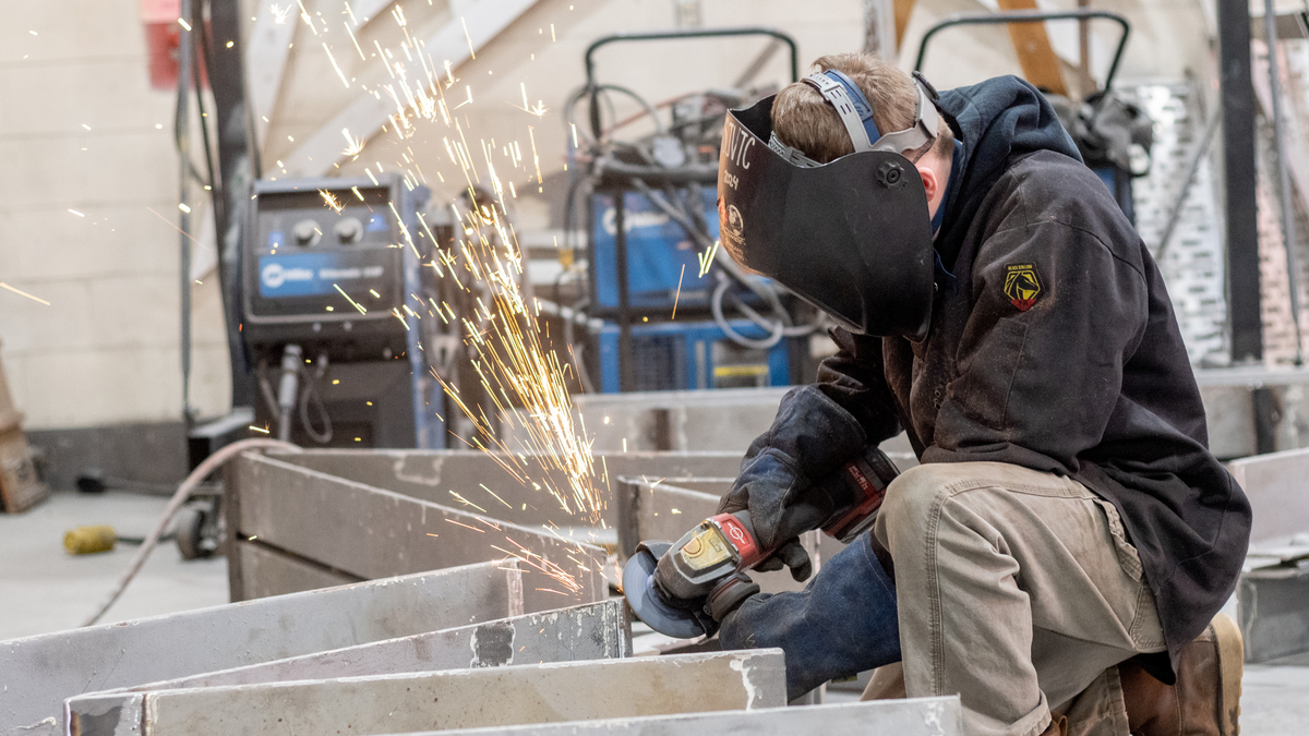 Tech students learn real-world skills while forging massive Acadian sculpture
